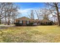 Classic brick home with shutters and well-kept lawn, inviting curb appeal at 5785 Susan E Dr, Indianapolis, IN 46250