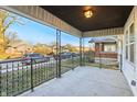Spacious front porch with decorative railings, offering a pleasant outdoor seating area at 741 N Linwood Ave, Indianapolis, IN 46201