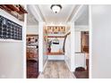 Inviting entryway boasting wood floors, storage, and convenient access to kitchen and living areas at 7816 E St Joseph St, Indianapolis, IN 46219