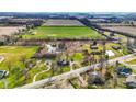 A bird's-eye view showcasing the ponds, winding paths, and greenery surrounding the property at 905 S Maple St, Fortville, IN 46040