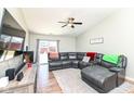 Comfortable living room with hardwood floors, ceiling fan, and a plush sectional sofa at 1269 Frogs Leap, Cicero, IN 46034