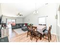 Spacious living room featuring vaulted ceilings, hardwood floors, and a sliding glass door at 1269 Frogs Leap, Cicero, IN 46034