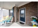 Inviting front porch with comfortable seating and a stylish door adding warmth and character at 16164 Loire Valley Dr, Fishers, IN 46037