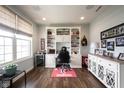 Spacious office with custom built-ins, a large window, and a comfortable workspace at 16164 Loire Valley Dr, Fishers, IN 46037