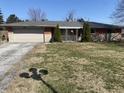 Exterior shot of the ranch style house on a sunny day with an attached garage at 224 Griffin Rd, Indianapolis, IN 46227