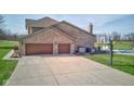 Attached two-car garage and basketball court area with a pool view at 2274 W Huntsville Rd, Pendleton, IN 46064