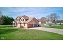 Spacious backyard featuring a pool, basketball court, and a well-maintained lawn at 2274 W Huntsville Rd, Pendleton, IN 46064