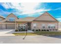 Charming single-story brick home featuring a welcoming front porch and attached garage, perfect for suburban living at 2326 Saddle Dr, Shelbyville, IN 46176
