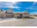 Attractive brick home with an attached garage and a cozy front porch, set in a quiet residential neighborhood at 2326 Saddle Dr, Shelbyville, IN 46176