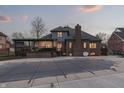 Beautiful backyard featuring a covered deck, inground pool, and a brick house at 4140 Sagewood Ct, Greenwood, IN 46143