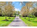 Long driveway leads to brick gate and lovely green lawns at 4491 N 75 W, Franklin, IN 46184