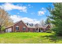 Charming brick home with a well-manicured lawn and inviting front porch at 4491 N 75 W, Franklin, IN 46184