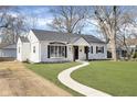 Attractive home with a neatly kept lawn and a inviting walkway at 5326 Graceland Ave, Indianapolis, IN 46208