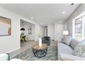Bright open-concept living area with stylish decor and a view to dining space at 5326 Graceland Ave, Indianapolis, IN 46208