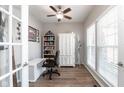 Bright office with ample natural light, neutral paint, and built-in shelving at 5852 Sunnyvalle Dr, Bargersville, IN 46106