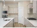 Stylish kitchen with stainless steel appliances, gas cooktop, and quartz countertops at 15810 Vitalize Run, Fishers, IN 46040