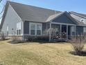 Beautiful home featuring gray siding, trimmed windows, and a well-maintained lawn at 1972 Mobley Dr, Westfield, IN 46074