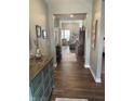 Inviting hallway with hardwood floors, stylish decor, and a view of the cozy living area at 1972 Mobley Dr, Westfield, IN 46074
