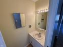 Cozy half bathroom with vanity and sink at 2826 Country Estates Dr, Indianapolis, IN 46227