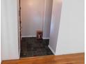 Inviting foyer with slate tile flooring, fresh paint, and natural light at 3300 Heritage Rd, Columbus, IN 47203
