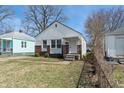 Cozy single-Gathering home with brick and siding, complemented by a green lawn at 3505 Ralston Ave, Indianapolis, IN 46218
