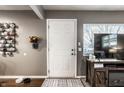 Inviting entryway with a view of a television and front yard window to give a welcoming view at 3867 Asbury St, Indianapolis, IN 46227
