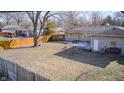 Spacious backyard featuring a patio, a fenced perimeter, and a grassy area at 5002 Kessler N Blvd, Indianapolis, IN 46228