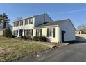 Classic two-story home with attached garage; lovely curb appeal on a large lot at 5420 N Arlington Ave, Indianapolis, IN 46226