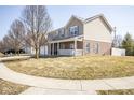 Attractive two-story home featuring a brick front and a covered front porch at 5897 W River Chase Ln, McCordsville, IN 46055