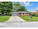Beautiful single-Gathering home with well-maintained lawn and a paved driveway at 629 Williamsburg Ln, Greenwood, IN 46142