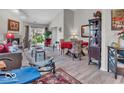 Bright living room with hardwood floors, comfortable seating, and a view of the outdoor scenery at 6556 Aintree Ter, Indianapolis, IN 46250