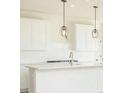 Modern kitchen with stainless steel appliances, island, and pendant lighting at 6818 Jacone Dr, Brownsburg, IN 46112