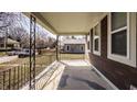 Inviting front porch with decorative railing and ample space for relaxing and enjoying the neighborhood views at 706 N Euclid Ave, Indianapolis, IN 46201