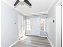 Inviting entryway featuring a clean, neutral palette, a new ceiling fan, and durable vinyl floors at 8026 Roy Rd, Indianapolis, IN 46219