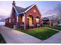Charming brick home with arched porch and inviting curb appeal at 1014 Shannon Ave, Indianapolis, IN 46201
