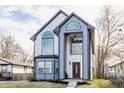 Stunning two-story home with modern design, large windows and manicured landscaping at 1533 Harlan St, Indianapolis, IN 46203