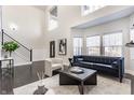 Bright living room with soaring ceilings, modern furniture, and ample natural light at 1533 Harlan St, Indianapolis, IN 46203