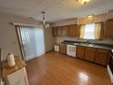 Traditional kitchen with wooden cabinets, stainless steel appliances, and hardwood floors at 1804 Austin Dr, Lebanon, IN 46052
