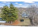 Aerial view showcasing the property with mature trees and outdoor space at 2123 N F St, Elwood, IN 46036