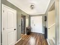Welcoming foyer with beautiful lighting and kitchen in the background at 3736 W South Wood Lake Dr, Columbus, IN 47201