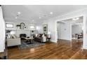 Spacious living room with hardwood floors, fireplace, and ample natural light at 4055 Broadway St, Indianapolis, IN 46205