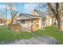 Inviting home showcasing a wooden deck, manicured lawn, and a serene outdoor space at 5414 Old Smith Valley Rd, Greenwood, IN 46143