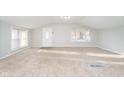 Bright and airy living room with plush carpeting and ample natural light at 5414 Old Smith Valley Rd, Greenwood, IN 46143