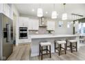 Bright kitchen featuring a large island, stainless steel appliances, and ample cabinet space at 5647 Stetson Dr, Whitestown, IN 46052
