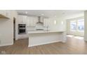 Open-concept kitchen featuring an island and modern stainless steel appliances at 5647 Stetson Dr, Whitestown, IN 46052