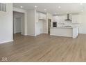 Spacious living area with kitchen and abundant natural light from many windows at 5647 Stetson Dr, Whitestown, IN 46052