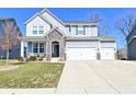Charming two-story home with stone accents and a spacious three car garage in a suburban neighborhood at 655 Bracknell Dr, Avon, IN 46123