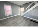 Living room with new flooring and natural light from the window at 745 W 25Th St, Indianapolis, IN 46208