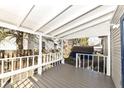 Back porch featuring white trim and railings, with a view of the backyard and fence at 821 S Lebanon St, Lebanon, IN 46052