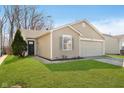 Charming single-story home featuring a one car garage, lawn, and neutral siding at 9049 Southernwood Way, Indianapolis, IN 46231